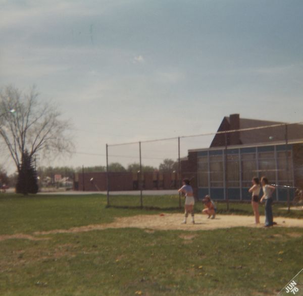the girl's softball team practice . . .