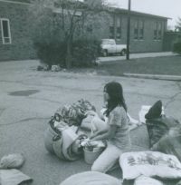 Shirley Pompa, waiting in the St. Norbert parking lot before our big over-night camping trip, May 30, 1975